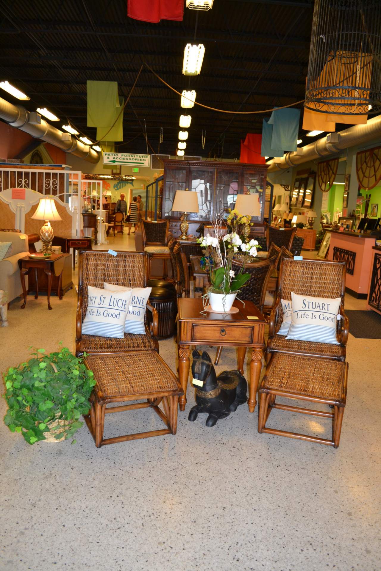 Gallery showroom with Rattan chairs and rattan footstools